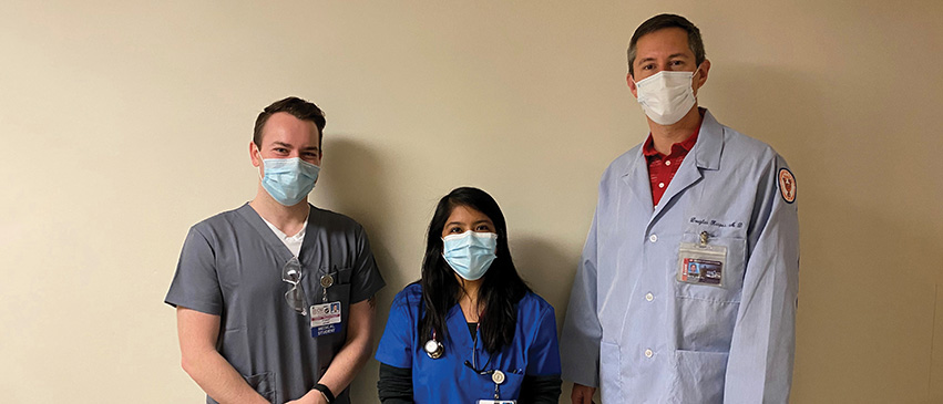 Dr. Kasper with third-year medical students Garret Waterstradt and Gabriela Gonzalez-Cantoran