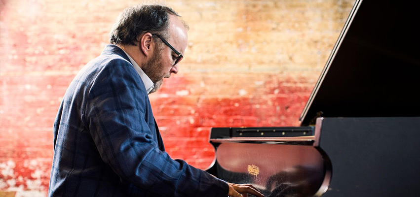 Monteith playing a piano