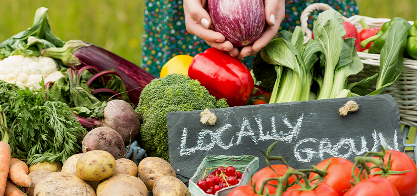 Vegetables with 'locally grown' sign