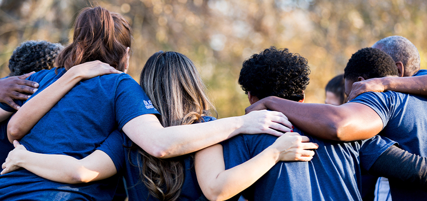 Group of People with arms around shoulders