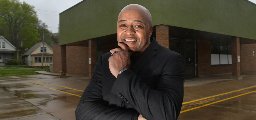 Rev. Chuck Brown, standing in front of future market