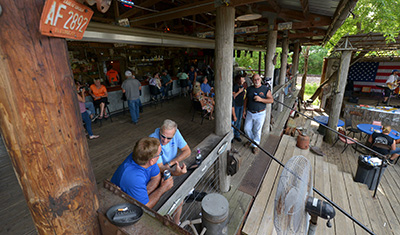 Bar patrons enjoying drink on the deck 